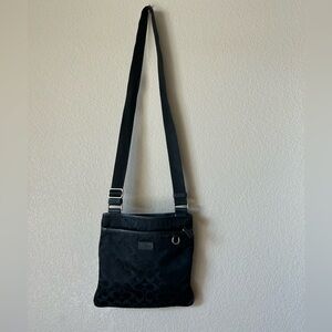 80*. COACH Black Signature Nylon Crossbody Bag
N-C1453-32971